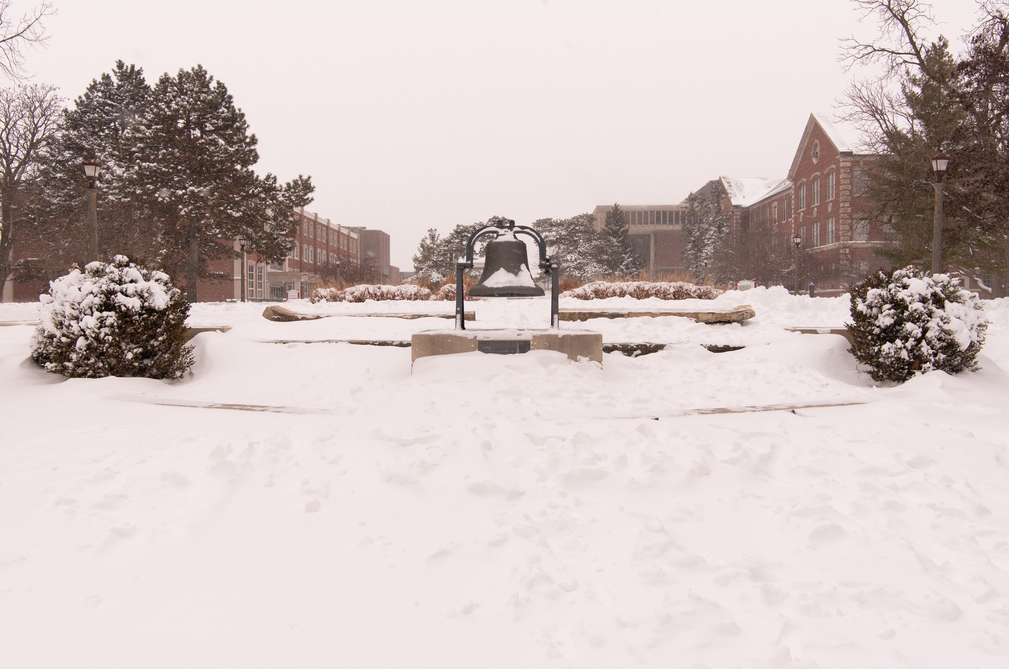 Snow covers the Old Main Bell on the ISU quad